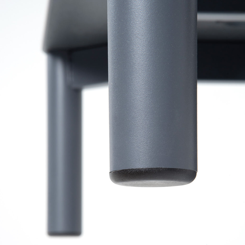 Close up image of the leg of a product showing the metal with powdercoat and protective foot glide. 